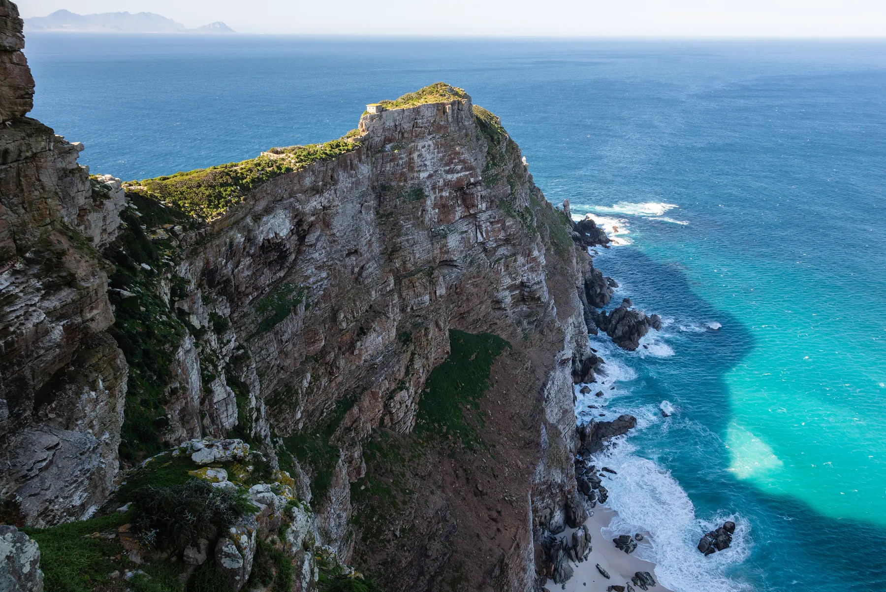 The cliffs of Cape Point dropping into turquoise water